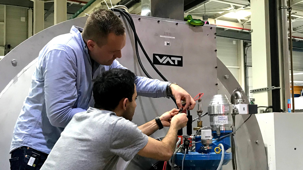 Two men working together in a lab.