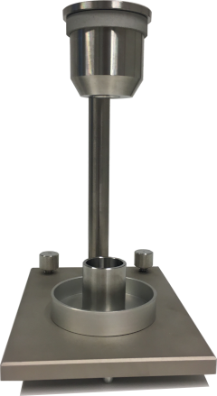 Photograph of the Hall flow funnel with apparent density testing cup at the KTH Powder Characterisation Laboratory.