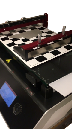 A photograph of the TQC Sheen thin film applicator at the KTH Powder Characterisation laboratory. A sample of powder has ben spread into a thin layer in order to measure its properties.